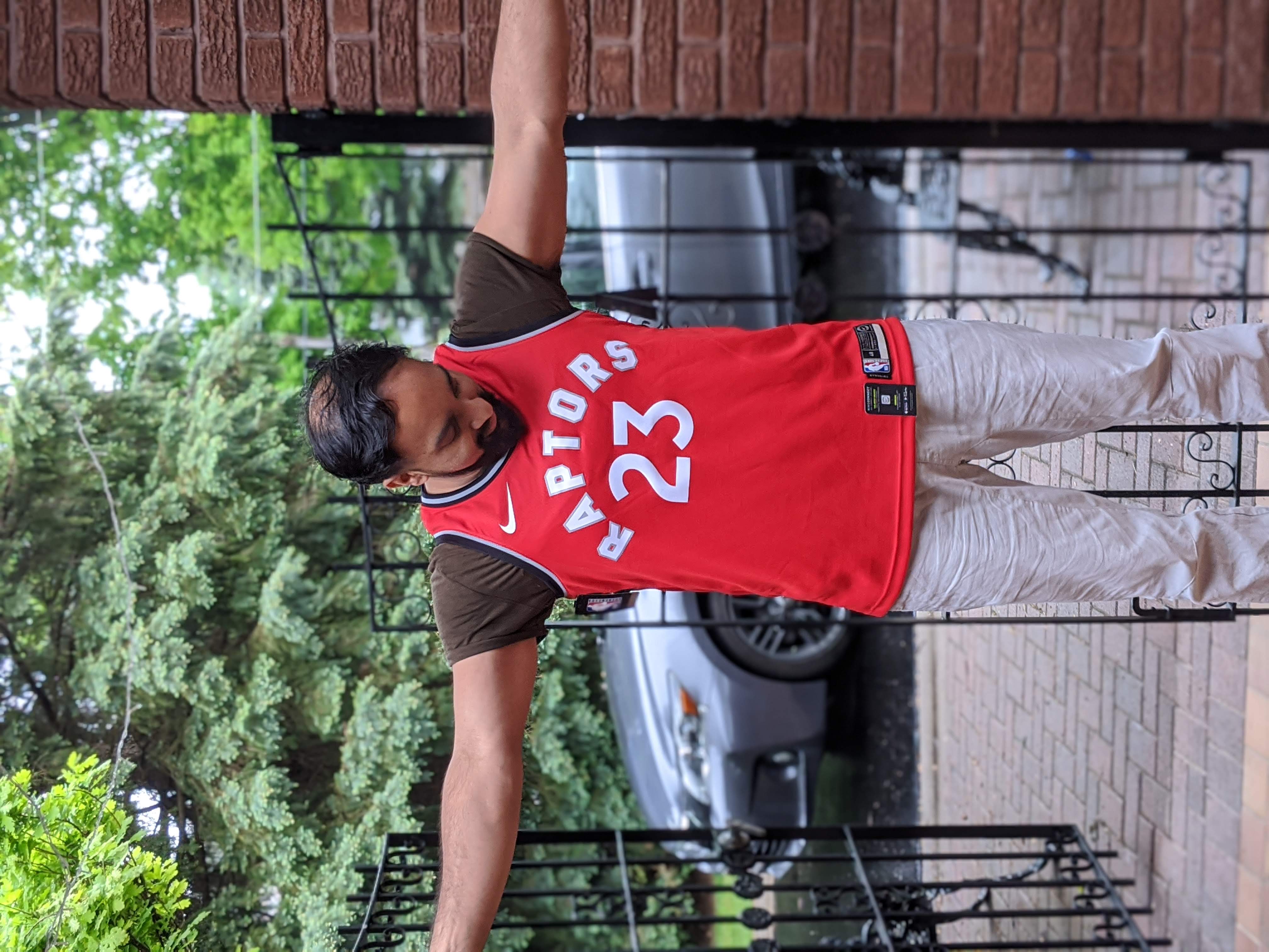 MJ wearing a MINHAS 23 Raptors jersey
